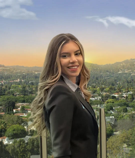 Marina Perovic Sadeghpour, CEO, on a balcony above Los Angeles at sunset